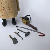 statuette articulée officielle de Leatherface avec piece interchangeable